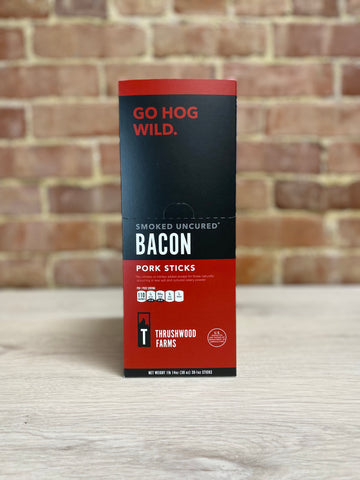 Image of a box of Thrushwood Farms Bacon snack sticks made with pork. 